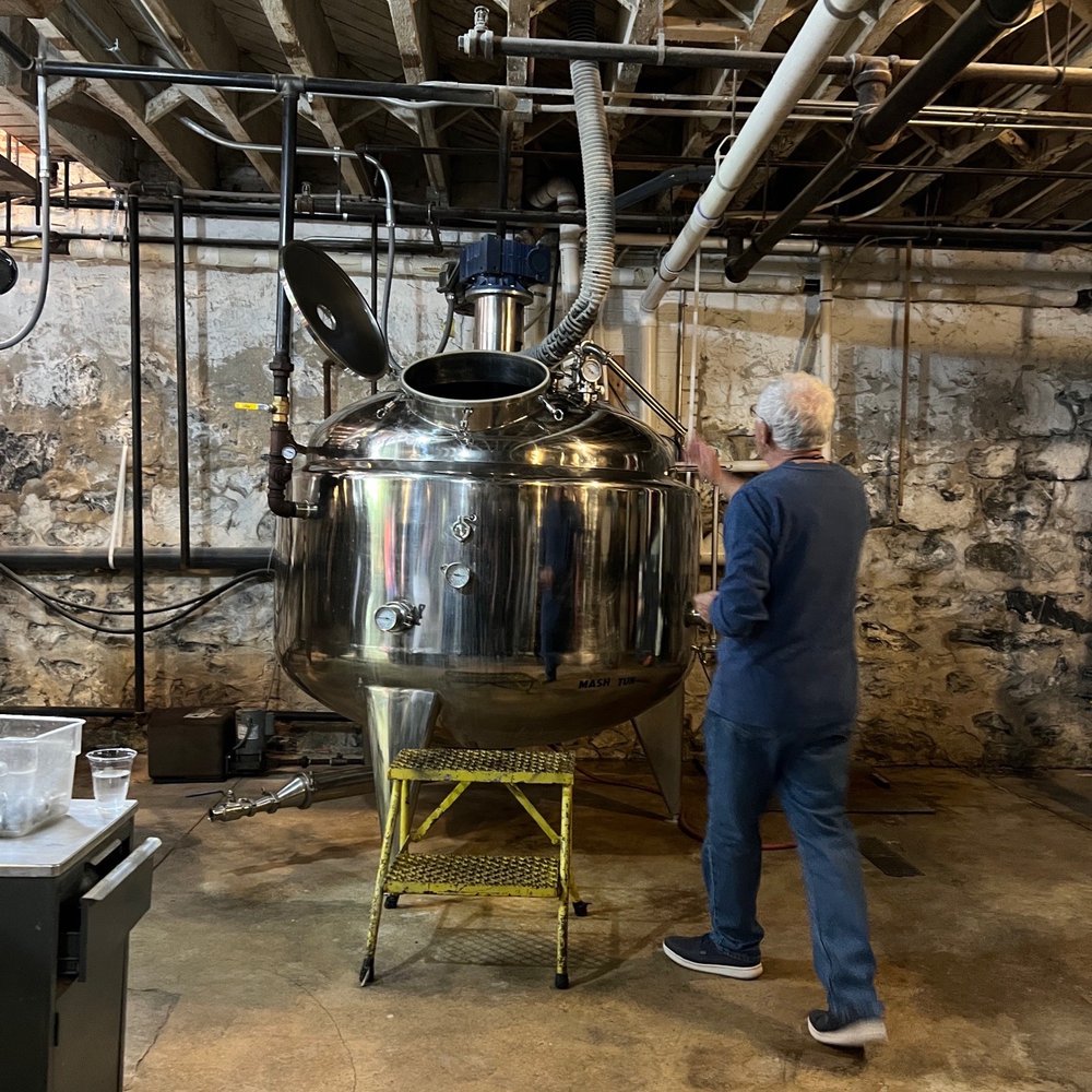 Thistle Finch Distillery - a man working in a brewery - Bars Near Me - Lancaster, Pennsylvania Thistle Finch Distillery - a man working in a brewery - Bars Near Me - Lancaster, Pennsylvania
