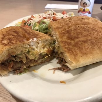 El Mariachi - Barbacoa Torta does not come halved. But it is easy to cut in half with the butter knife. - Mexican Near Me - Kapolei, Hawaii El Mariachi - Barbacoa Torta does not come halved. But it is easy to cut in half with the butter knife. - Mexican Near Me - Kapolei, Hawaii