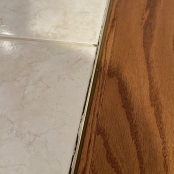 Empire Today - gap between tile and wood floor - Carpet Installation Near Me