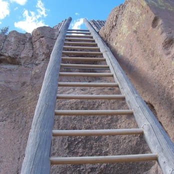 Puye Cliff Dwellings - The Ladder to the upper ruins - Tours Near Me - Espanola, New Mexico Puye Cliff Dwellings - The Ladder to the upper ruins - Tours Near Me - Espanola, New Mexico