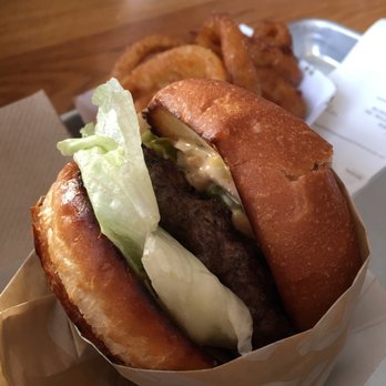 Gotts Roadside - Hamburger with lettuce, tomatoes, and pickles on a brioche bun. - Burgers Near Me - Napa, California
