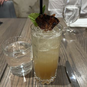FinePrint - a glass of water and a drink on a table - French Near Me - Calgary, Alberta