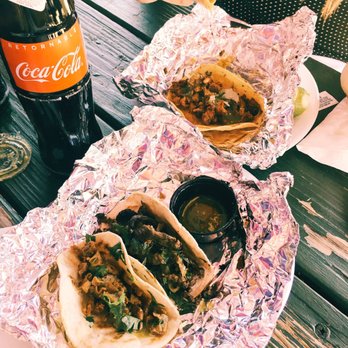 Las Trancas - Tripas and Asada tacos with extra cilantro and no onions and the Pastor taco with a bottle of Coke - Mexican Near Me - Austin, Texas