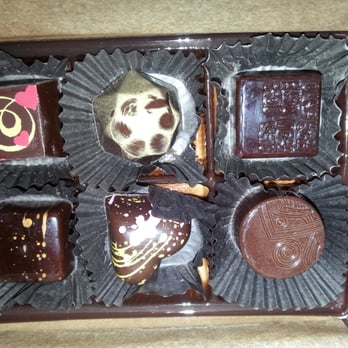 Casa De Chocolates - I don't remember all of them. #4 clockwise is the sea salt caramel, the heart is the guayaba, and #3 is the Mayan expresso. - Chocolatiers & Shops Near Me - Berkeley, California