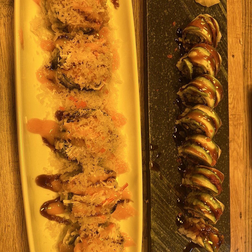 Thai N Sushi - Ninja roll on white plate and Dragon roll on black plate. - Sushi Bars Near Me - Quinlan, Texas Thai N Sushi - Ninja roll on white plate and Dragon roll on black plate. - Sushi Bars Near Me - Quinlan, Texas