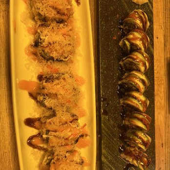 Thai N Sushi - Ninja roll on white plate and Dragon roll on black plate. - Sushi Bars Near Me - Quinlan, Texas Thai N Sushi - Ninja roll on white plate and Dragon roll on black plate. - Sushi Bars Near Me - Quinlan, Texas