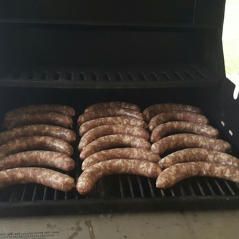 Nona's Pizzeria - sausages cooking on a grill - Pizza Near Me - Sterling Heights, Michigan Nona's Pizzeria - sausages cooking on a grill - Pizza Near Me - Sterling Heights, Michigan