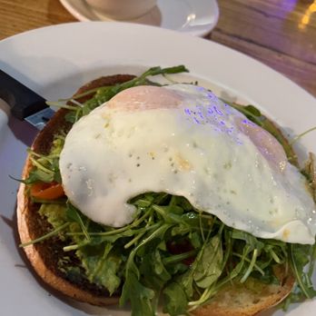 Honeybear Cafe - Avocado Toast (there are two slices of bread, arugula, cherry tomatoes) Side of fruit included - Breakfast & Brunch Near Me - Chicago, Illinois