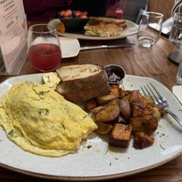 CRAFT 3 ITEMS OMELETS, Lu Potatoes, and rustic toast with strawberry jam. And a Raspberry mimosa.