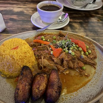Pisco Latin Kitchen - Ropa Vieja with yellow rice, plantains and black beans - Latin American Near Me - Sandy Springs, Georgia Pisco Latin Kitchen - Ropa Vieja with yellow rice, plantains and black beans - Latin American Near Me - Sandy Springs, Georgia
