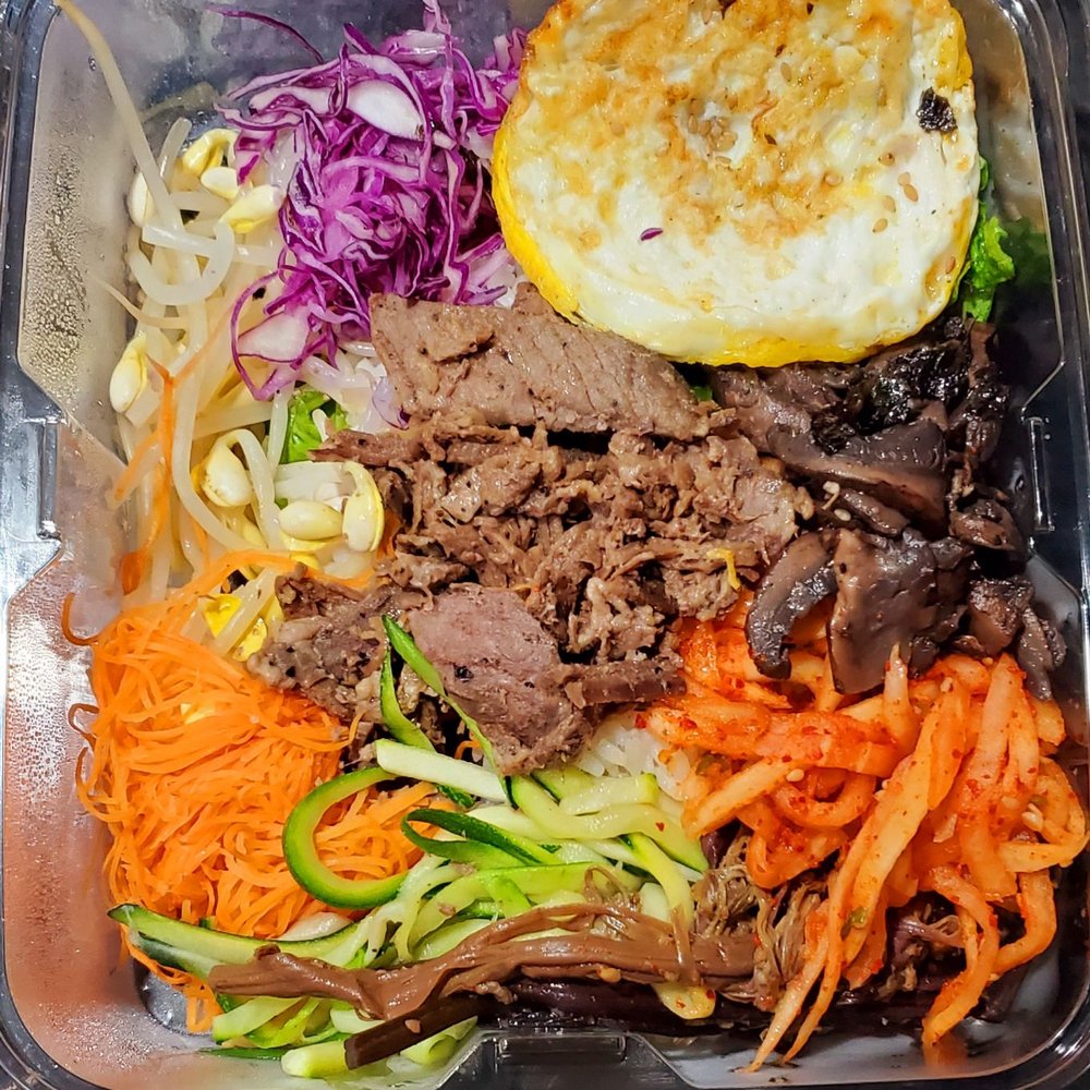 Rolly Kimbab - Bulgogi bimbimbap before mixing. Fried egg, kimchi, red cabbage,  mushrooms,  cucumber, bean sprouts, carrot, lettuce, over rice. Fresh. - Korean Near Me - Bayside, New York