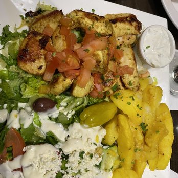 Nick's Taverna - Chicken souvlaki dinner with Greek potatoes and salad. - Mediterranean Near Me - Ashburn, Virginia Nick's Taverna - Chicken souvlaki dinner with Greek potatoes and salad. - Mediterranean Near Me - Ashburn, Virginia