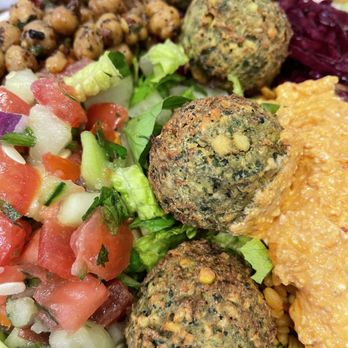 Wild Fig - Falafel Bowl (created my own) with spicy feta, tomatoes and cucumbers, chick peas and red cabbage. - Turkish Near Me - Roslyn, New York Wild Fig - Falafel Bowl (created my own) with spicy feta, tomatoes and cucumbers, chick peas and red cabbage. - Turkish Near Me - Roslyn, New York