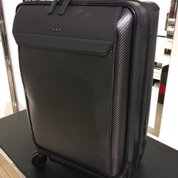 Tumi - Carbon Fiber $1995.00 was quite heavy but was beautiful. Too expensive for my needs as I prefer the Merge Collection.