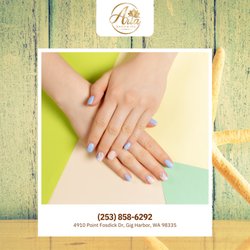 High-gloss periwinkle blue nails pair beautifully with sharp geometric color blocking. A cozy knitted accent finger adds tactile design.