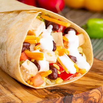Chicken Kitchen - a burrito on a cutting board - Chicken Shop Near Me - Miami, Florida