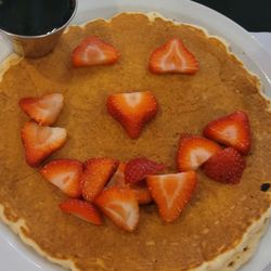 Mr. Rivers Breakfast Joint - Single pancake with strawberries.