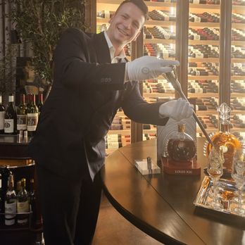WeVINO - White glove pouring Louis XIII Cognac with a metallic pipette - Wine Bars Near Me - Westlake Village, California WeVINO - White glove pouring Louis XIII Cognac with a metallic pipette - Wine Bars Near Me - Westlake Village, California