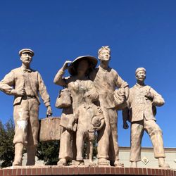 Vietnam War Memorial - This statue's name is "Refugees" which reflects well with this mall Universal Shopping Center