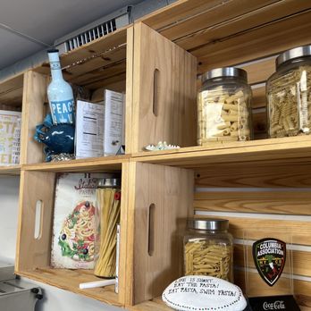 Cheese Wheel Pasta - a variety of ingredients on shelves - Italian Near Me - Ocean City, Maryland Cheese Wheel Pasta - a variety of ingredients on shelves - Italian Near Me - Ocean City, Maryland