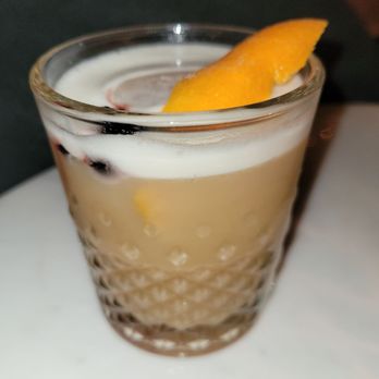 Evergreen Hermann - a drink in a glass on a table - Cocktail Bars Near Me - Hermann, Missouri
