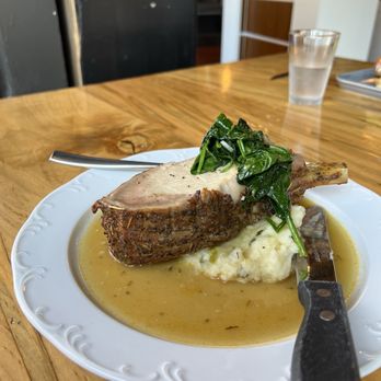 Sofia's Kitchen Bar - Pork Prime Rib,bone-in slow roasted rib loin, rosemary/salt/cracked pepper rub,potato mash with cabbage, leeks, garlic spinach, au jus - American Near Me - Lakewood, Ohio Sofia's Kitchen Bar - Pork Prime Rib,bone-in slow roasted rib loin, rosemary/salt/cracked pepper rub,potato mash with cabbage, leeks, garlic spinach, au jus - American Near Me - Lakewood, Ohio