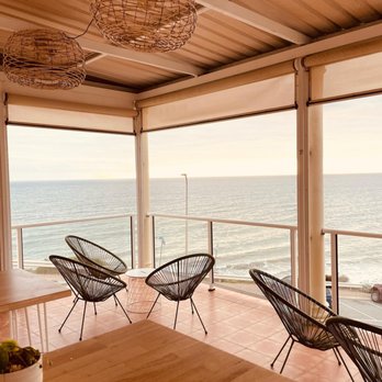 Marino Rocks Social - Upstairs balcony overlooking the ocean- stunning in summer. - Cafes Near Me - Marino, SA Marino Rocks Social - Upstairs balcony overlooking the ocean- stunning in summer. - Cafes Near Me - Marino, SA