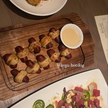 the Woodall - Lump crab, pigs in a blanket, tuna poke - Cocktail Bars Near Me - Atlanta, Georgia