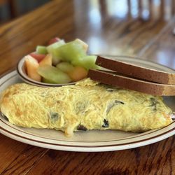 Omelette Express - Create Your Own Omelette: mushrooms, cheddar/jack cheese & avocado/guacamole & GF toast. Sub'd out potatoes for fruit.