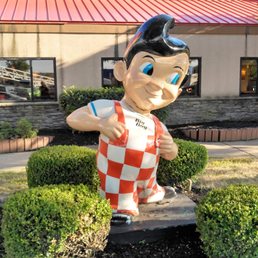 Bob with his bib outside on the front lawn.  The front red roof part is the glass sunroom part at some Big Boy's in other parts of the U.S.
