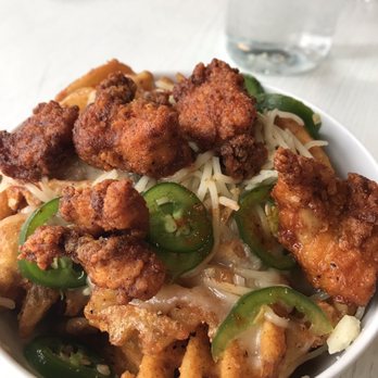 Hancock - Waffle cut fried chicken poutine! So good. - Chicken Shop Near Me - Grand Rapids, Michigan Hancock - Waffle cut fried chicken poutine! So good. - Chicken Shop Near Me - Grand Rapids, Michigan