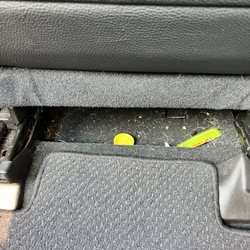 Under drivers seat.