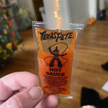 Marcy's Diner - a hand holding a hot sauce - Diners Near Me - Portland, Maine Marcy's Diner - a hand holding a hot sauce - Diners Near Me - Portland, Maine