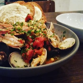 Spencer - Cioppino of prawns, Maine mussel, and manilla clams, searved with aioli, gremolata, and grilled bread. - New American Near Me - Ann Arbor, Michigan Spencer - Cioppino of prawns, Maine mussel, and manilla clams, searved with aioli, gremolata, and grilled bread. - New American Near Me - Ann Arbor, Michigan