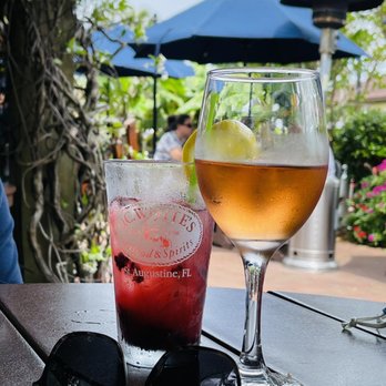 O. C. White's Restaurant - Black Berry lemonade ice tea and Chloe Rosé under the trestle. - Seafood Near Me - St Augustine, Florida