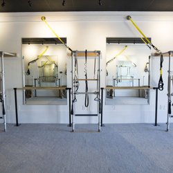 BASI Pilates Academy - Studio is fully outfitted in state of the art BASI Pilates apparatus' as of July 2022, Barre, and TRX. Seen here is our Barre Studio.