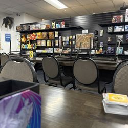 Amazing Discoveries - Merch wall and tables