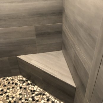 Mosaica Tile - a walk in shower with a bench - Flooring Near Me Mosaica Tile - a walk in shower with a bench - Flooring Near Me