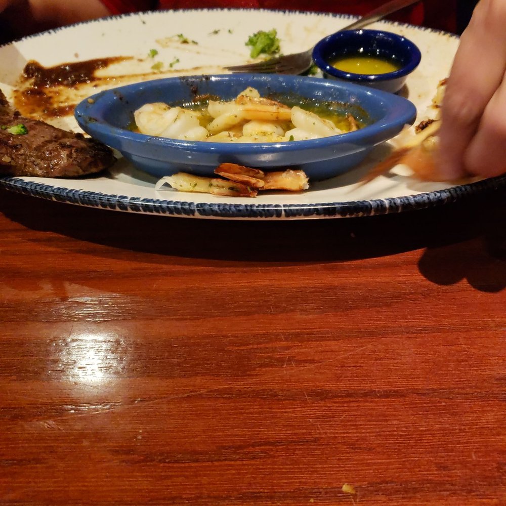a plate of food on a wooden table