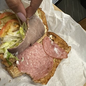 Potbelly - Two paper this slices of meat buried in a sub roll and hidden under vegetables - Sandwiches Near Me - Houston, Texas Potbelly - Two paper this slices of meat buried in a sub roll and hidden under vegetables - Sandwiches Near Me - Houston, Texas