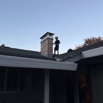 A Cozy Chimney - Eli installing the chimney rain cap - Chimney Sweeps Near Me