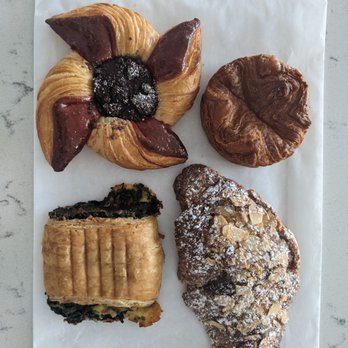 Patisserie 46 - Pointsetta pastry, kouign Amann, spinach feta puff, almond paste croissant. All delicious! - Bakeries Near Me - Minneapolis, Minnesota