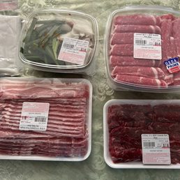 Rice paper, spicy marinated squid & pork belly, brisket, pork belly, and skirt steak Rice paper, spicy marinated squid & pork belly, brisket, pork belly, and skirt steak