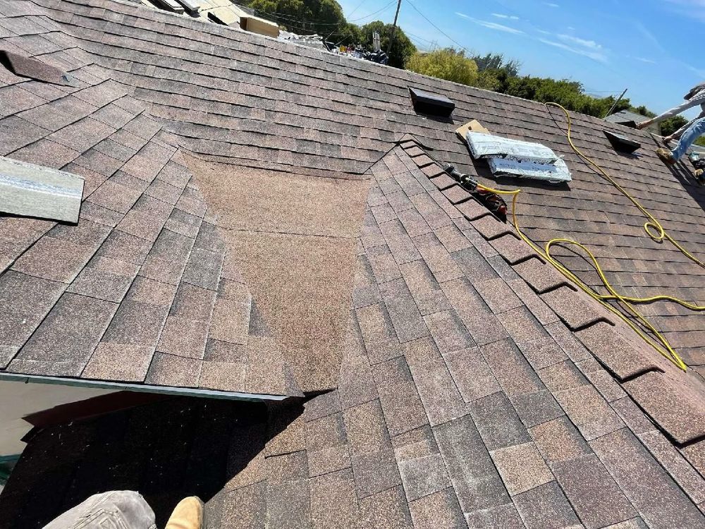 Slide of T J Roofing