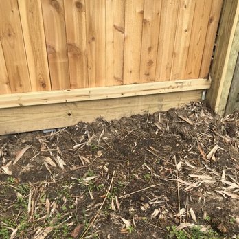 Rosales Fence Co. - Looks like someone's measurements were off on the last piece of wood. I wonder if it cost extra to level out the soil/clean up. - Fences & Gates Near Me