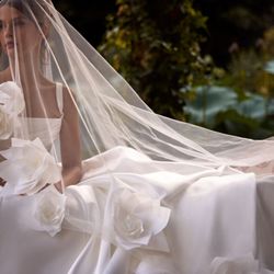 I Do Wedding Dresses and Photography - Brides love this Milla Nova design for its dramatic train and romantic details.