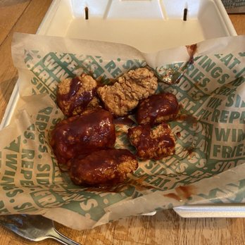 Wingstop - a tray of food on a table - Chicken Wings Near Me - Hollister, California Wingstop - a tray of food on a table - Chicken Wings Near Me - Hollister, California