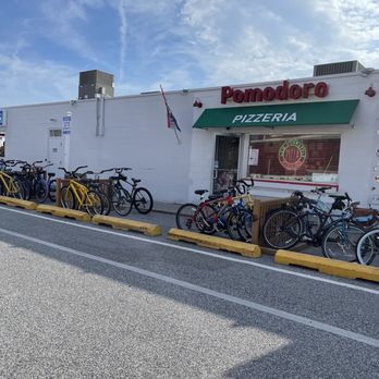 Pomodoro Pizzeria - a row of bicycles parked in front of a restaurant - Pizza Near Me - Bethany Beach, Delaware Pomodoro Pizzeria - a row of bicycles parked in front of a restaurant - Pizza Near Me - Bethany Beach, Delaware