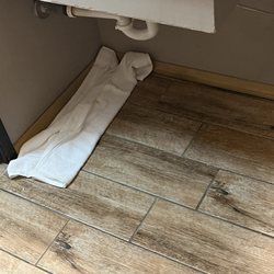 Super 8 by Wyndham Cortez/Mesa Verde Area - Towel used to wipe up the water that sprayed from the pipes when sink was turned on.