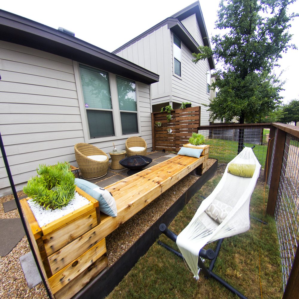 Austin Creative Landscaping - Our cozy corner with a custom wall and hanging plants. We added the fire pit and hammock later on. - Landscaping Near Me - Austin, Texas Austin Creative Landscaping - Our cozy corner with a custom wall and hanging plants. We added the fire pit and hammock later on. - Landscaping Near Me - Austin, Texas